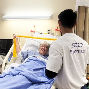 volunteer helping patient