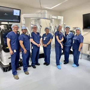 a group of doctors standing and smiling