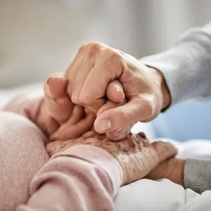 two people holding hands
