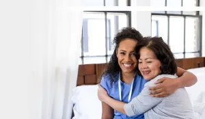 patient hugging nurse