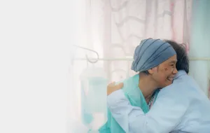 a patient hugging their family member