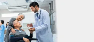 a doctor talking to a patient in a wheelchair