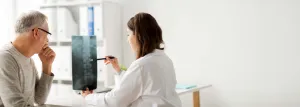 a doctor showing a patient his x-ray
