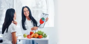 a nutritionist helping a patient