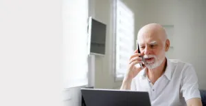A older person with a laptop