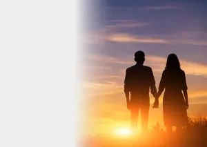a man and women holding hands watching the sunset