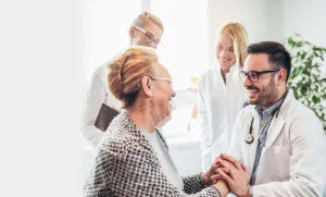patient holding doctor hand